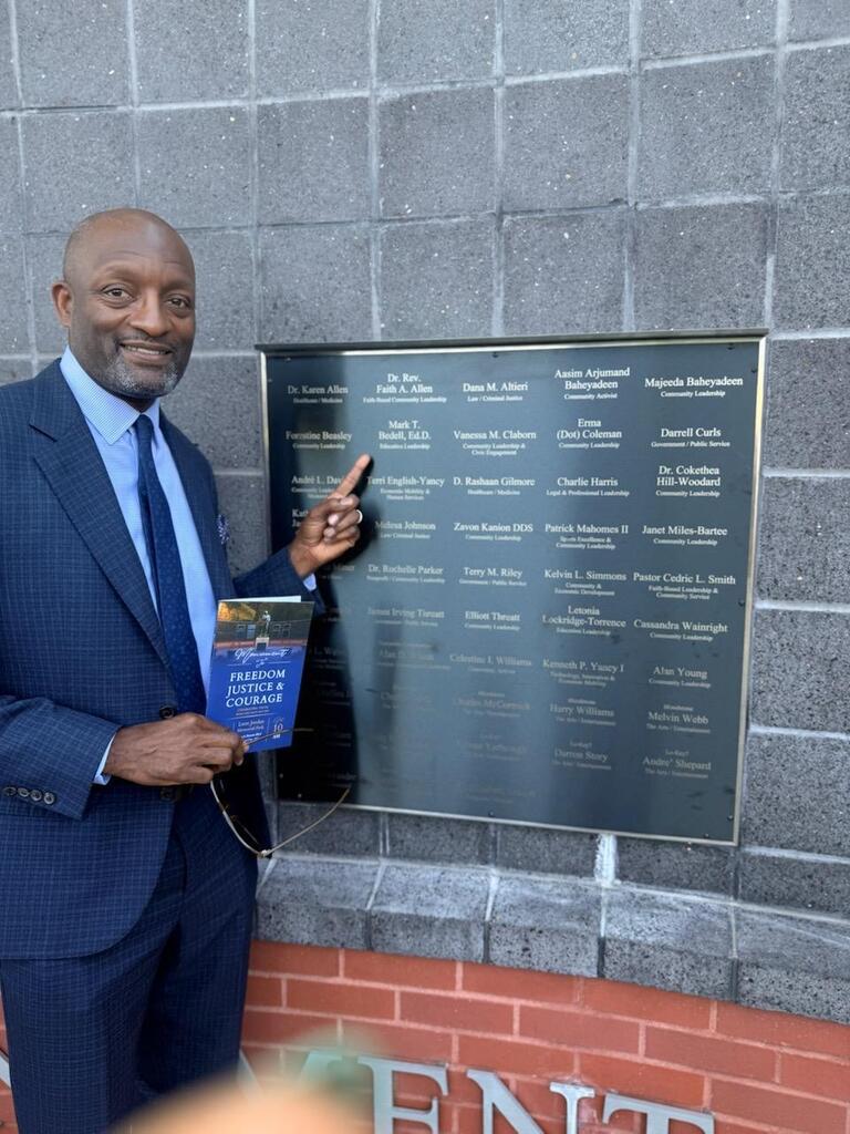 Dr. Bedell at monument wall