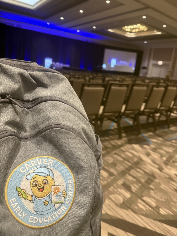 carver peanut backpack in an empty banquet room