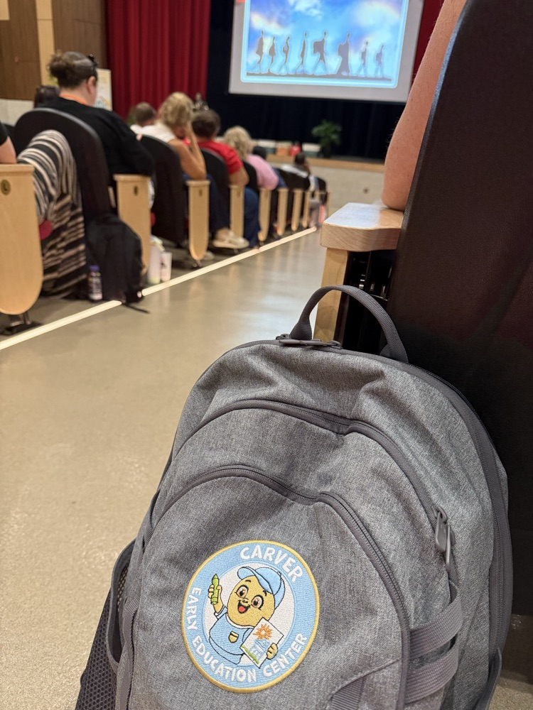 Backpack with Carver Logo sitting in an auditorium