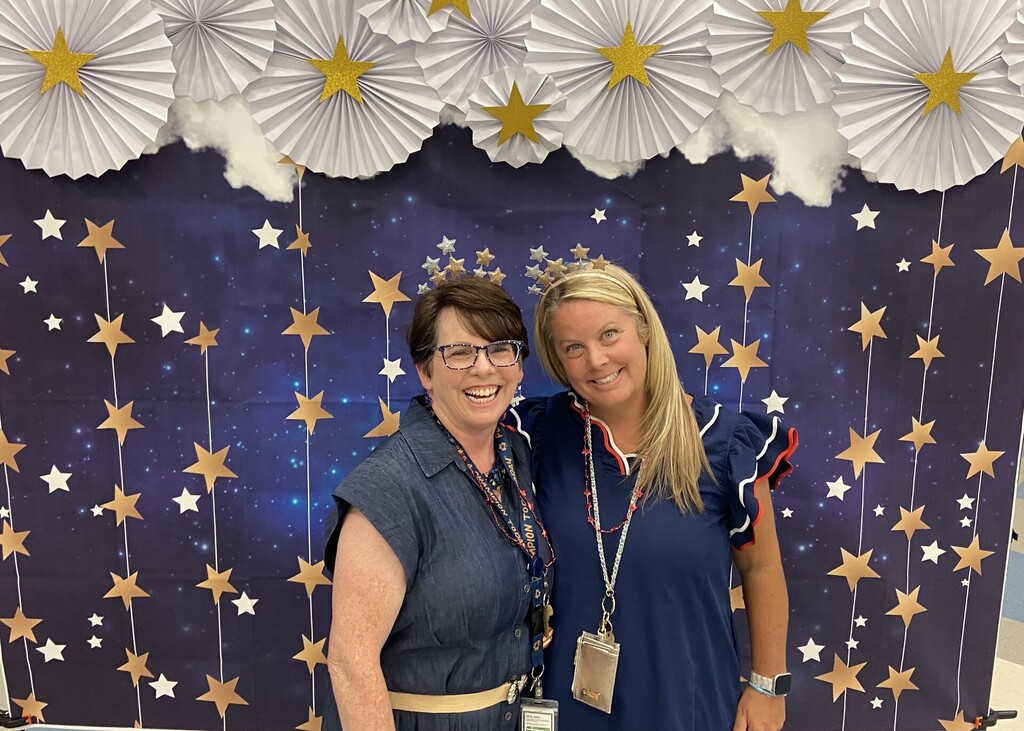 The two school counselors are posed in front of a star backdrop to mark the beginning of the school year for all AACPS staff.