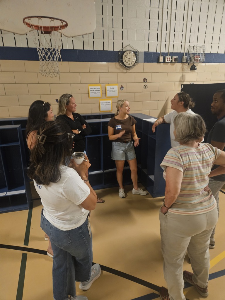staff talking in a circle