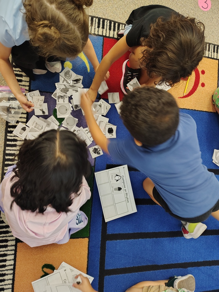 students grabbing rhythm cards