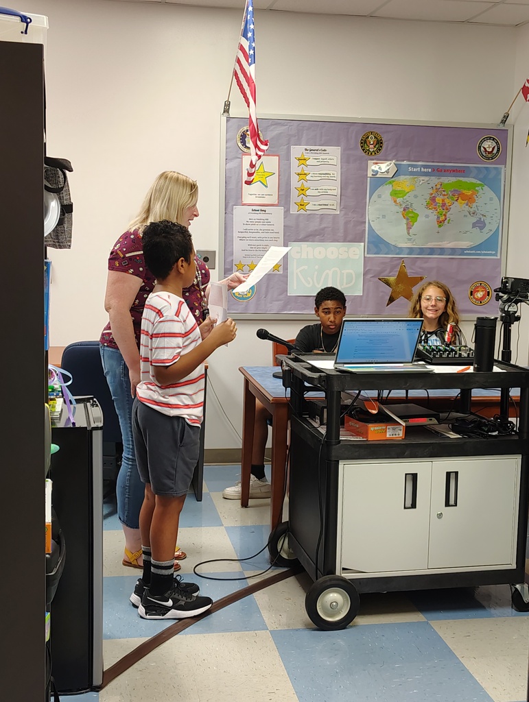 Teacher and students leading announcements