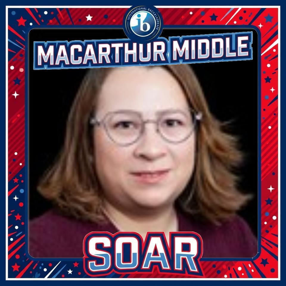Woman with glasses and brown hair wearing a maroon shirt with "SOAR" below. Text reads "MACARTHUR MIDDLE" at top.