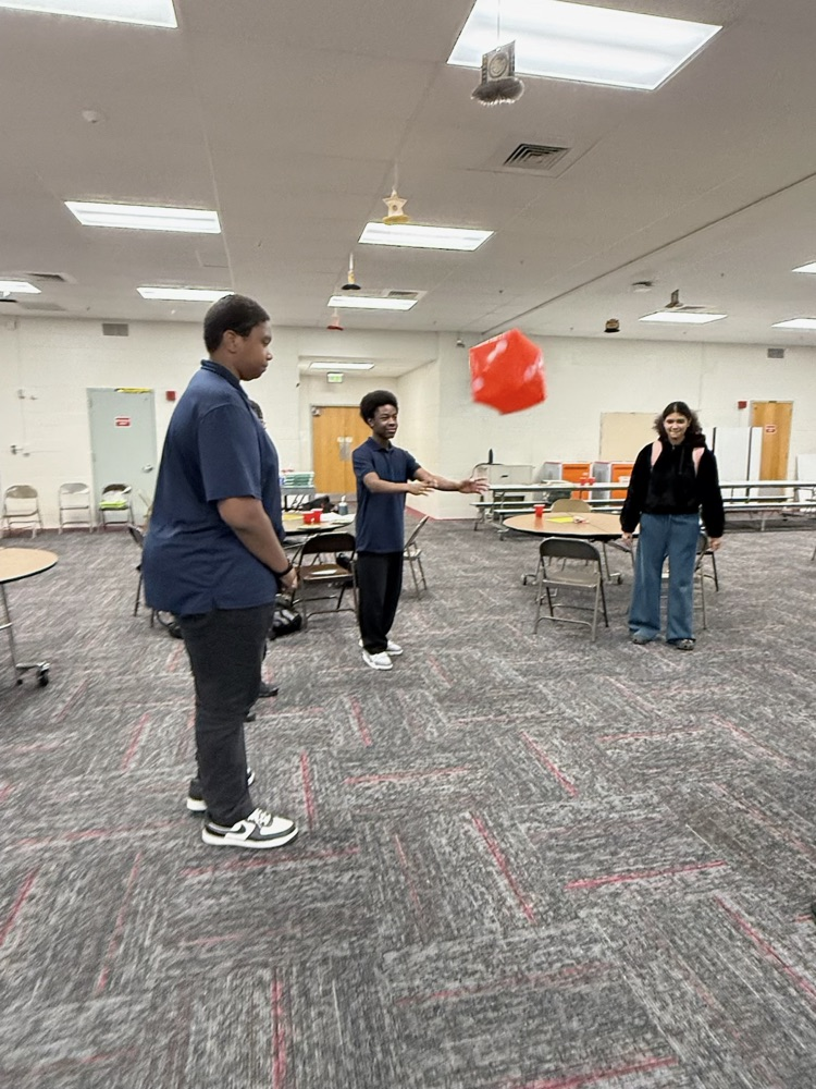 student tossing dice