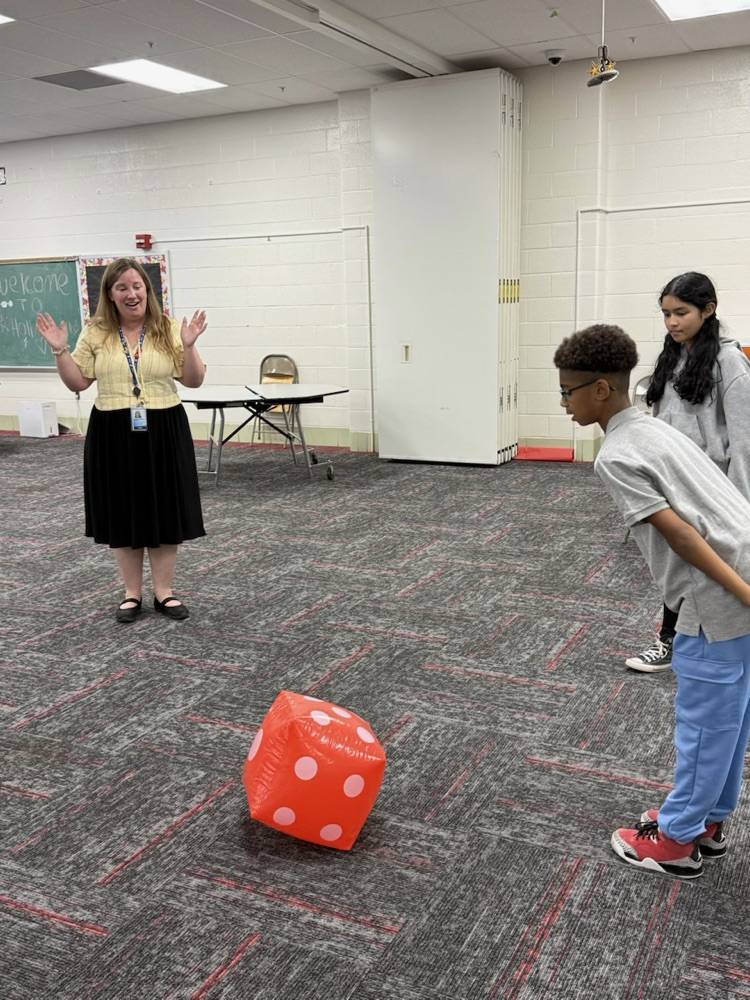 students tossing dice