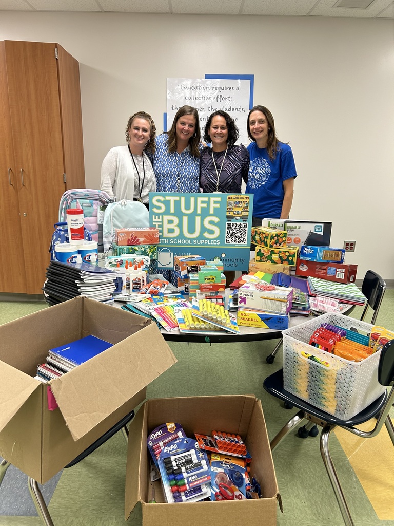 School staff with school supplies
