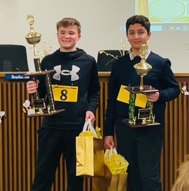 Top two finishers at 38th Anne  Arundel County Public Schools Spelling Bee with trophies