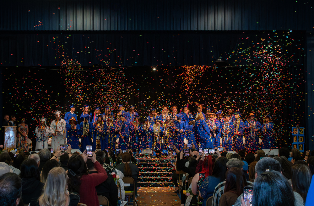 gym with graduates and confetti