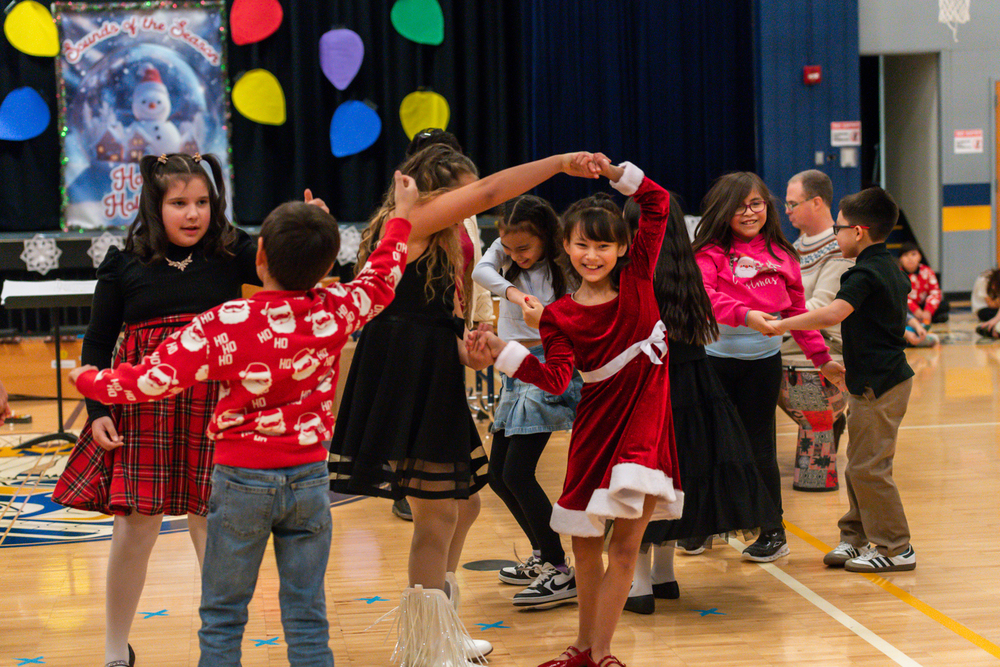 students dancing at holiday concert