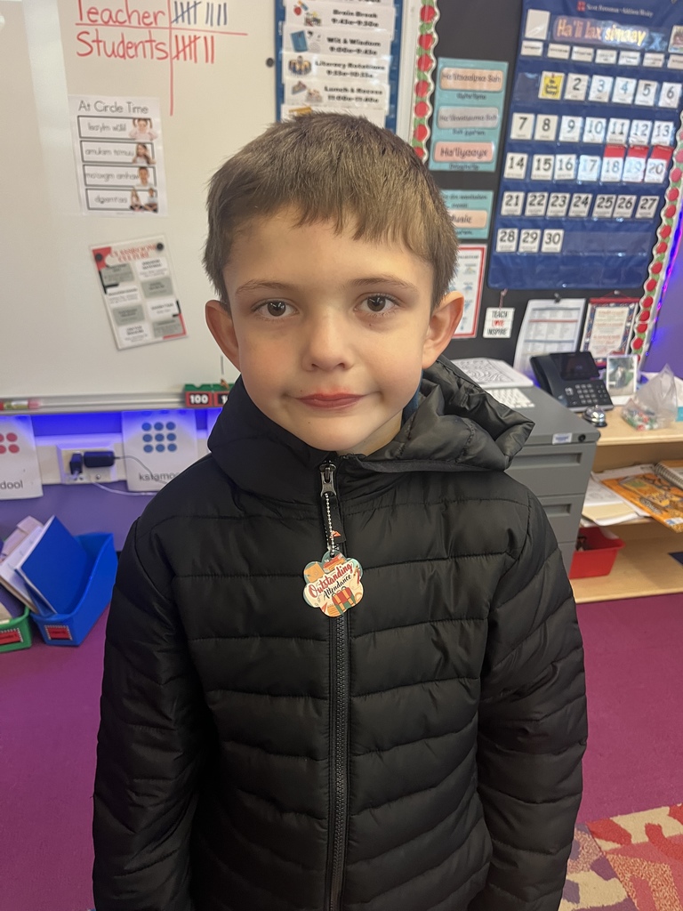 student with special tag on zipper 