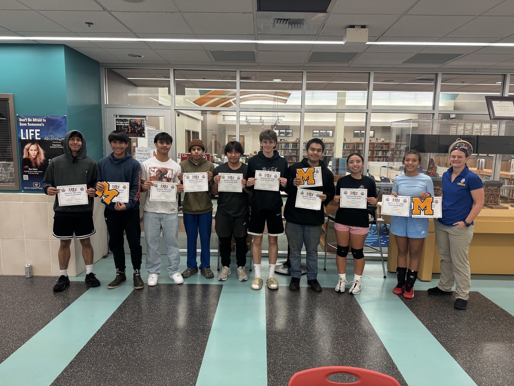 students holding awards and letters