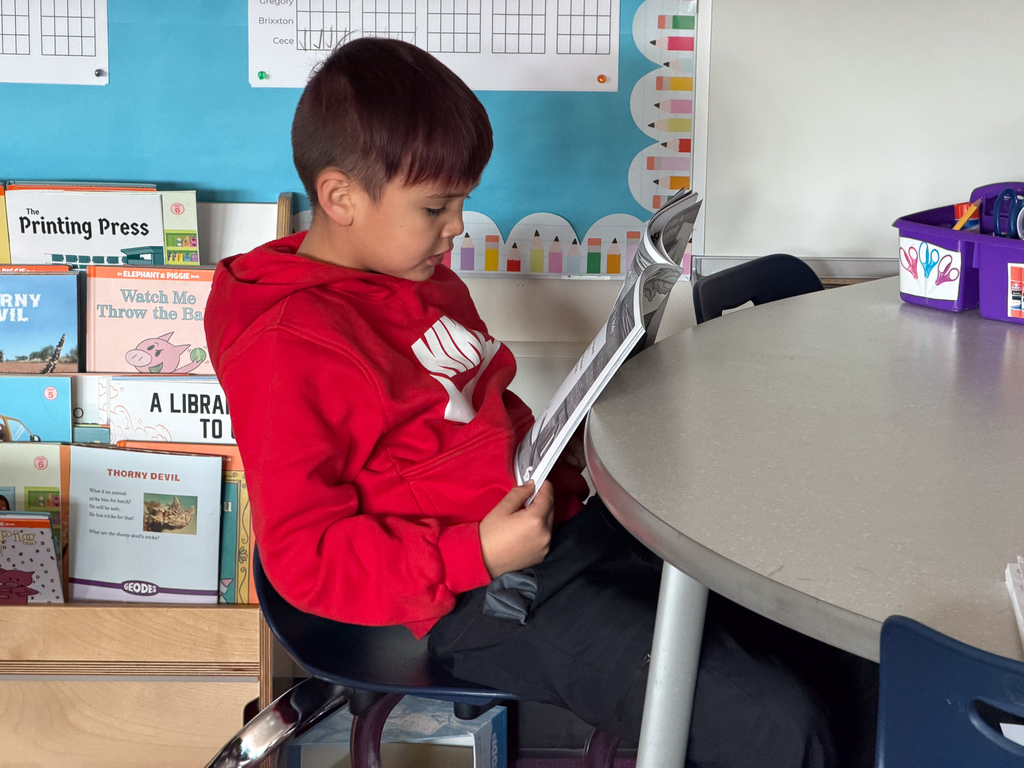 student reading in classroom