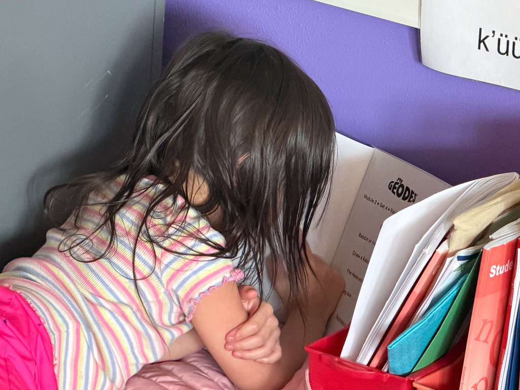 student reading in classroom
