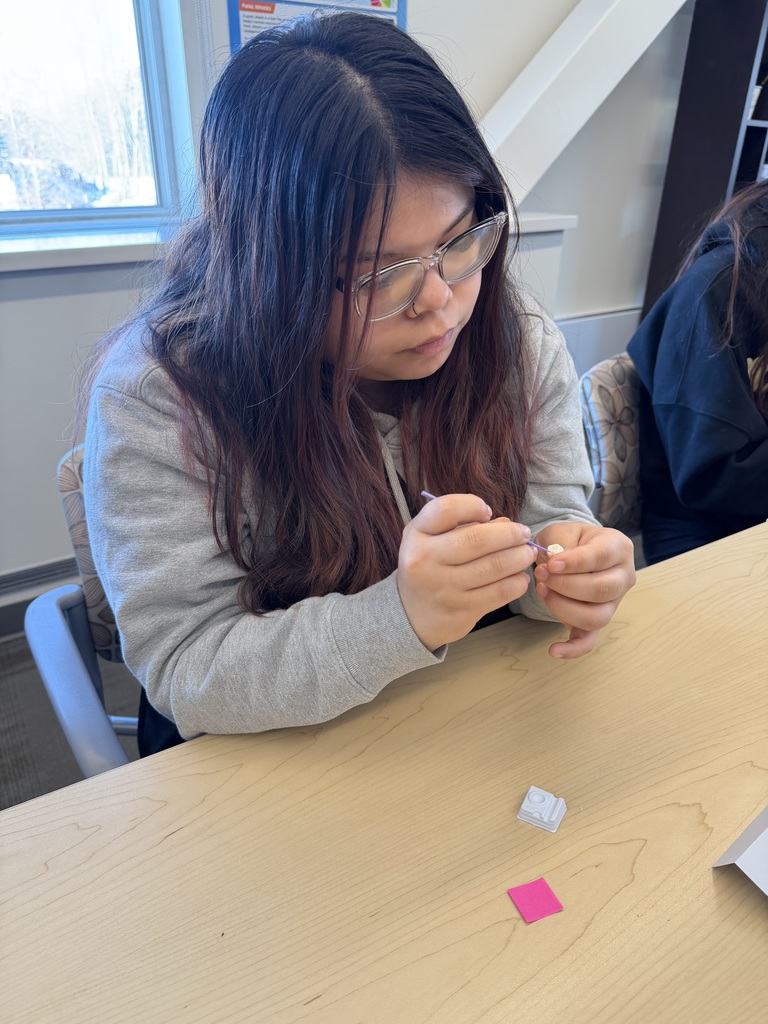 student working at a desk