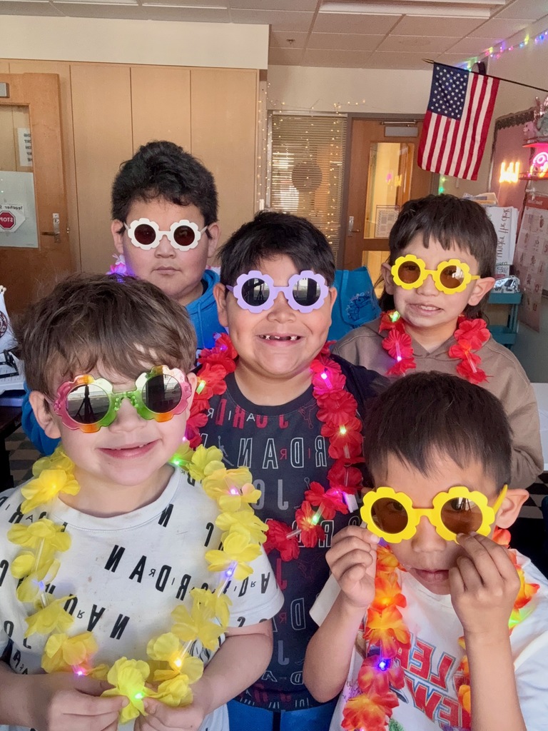 students wearing sungasses and leis