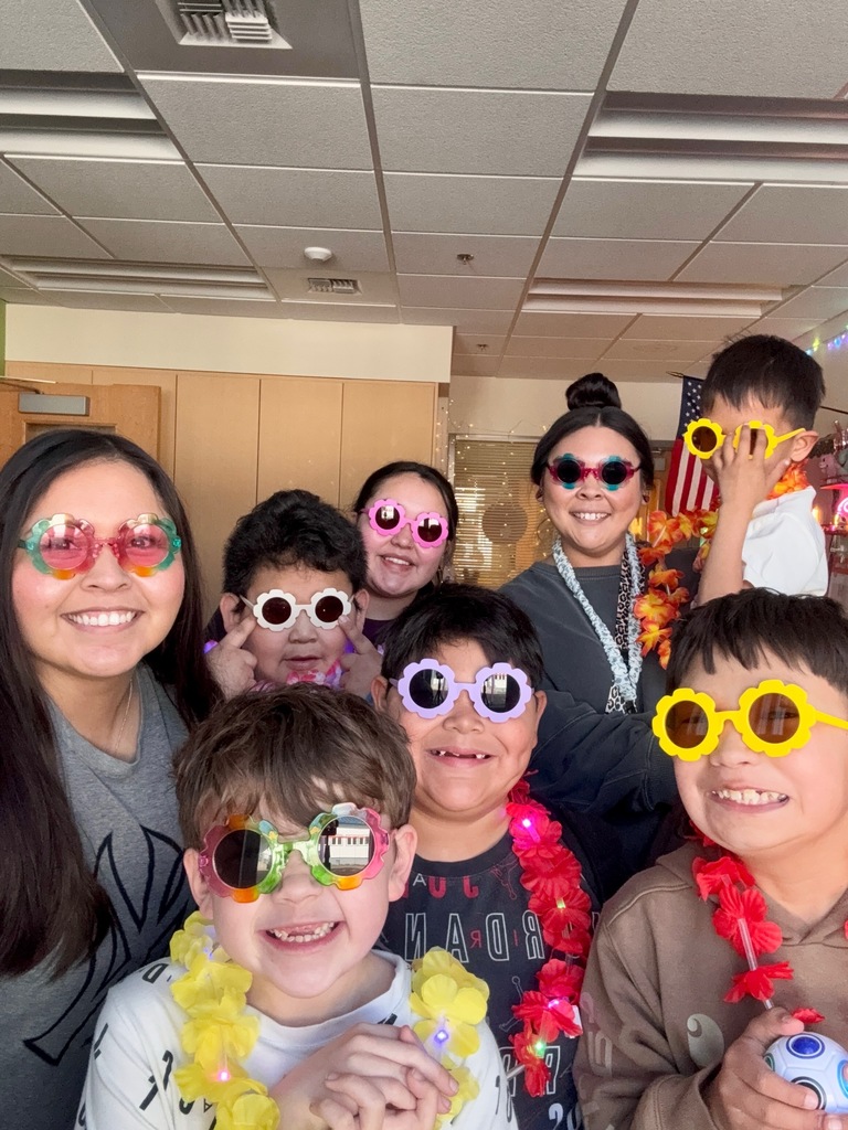 students wearing sungasses and leis