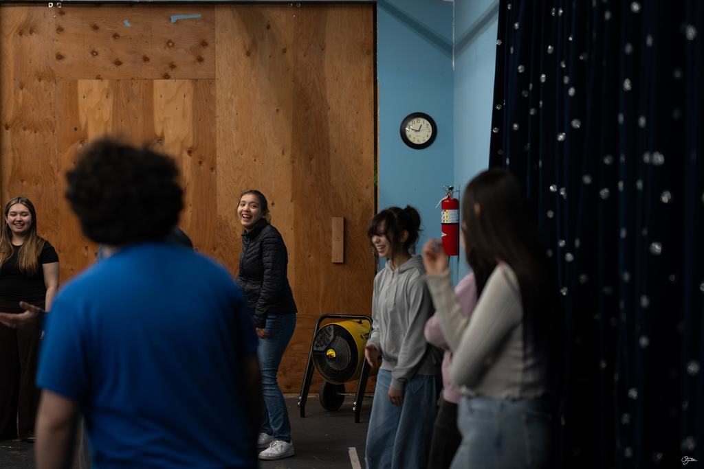 students acting in theater class