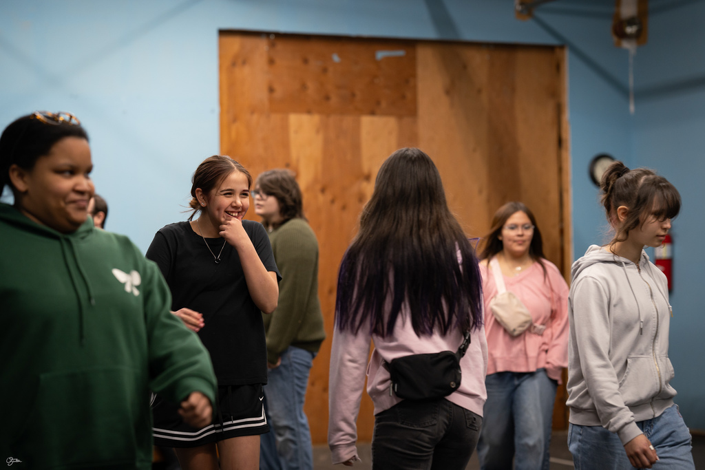 students acting in theater class