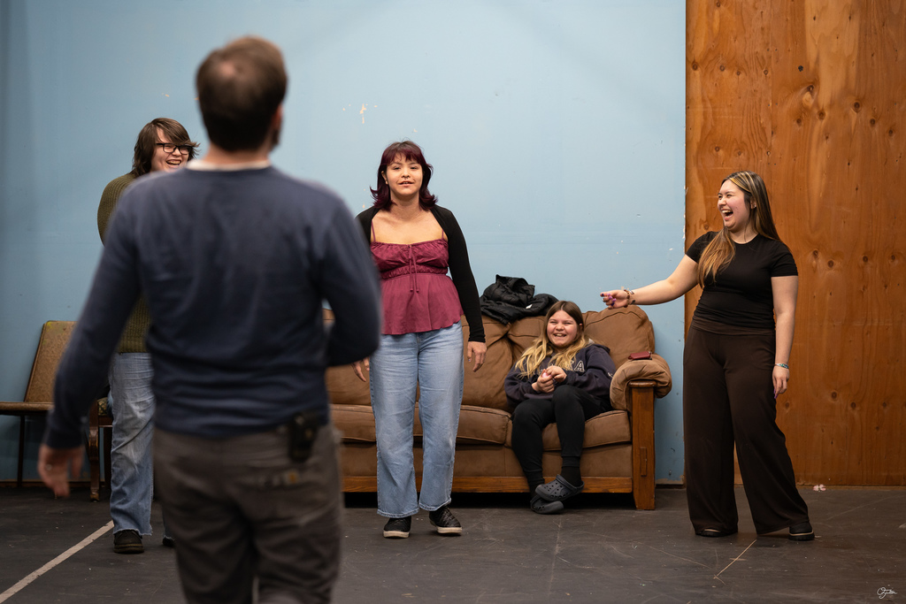 students acting in theater class