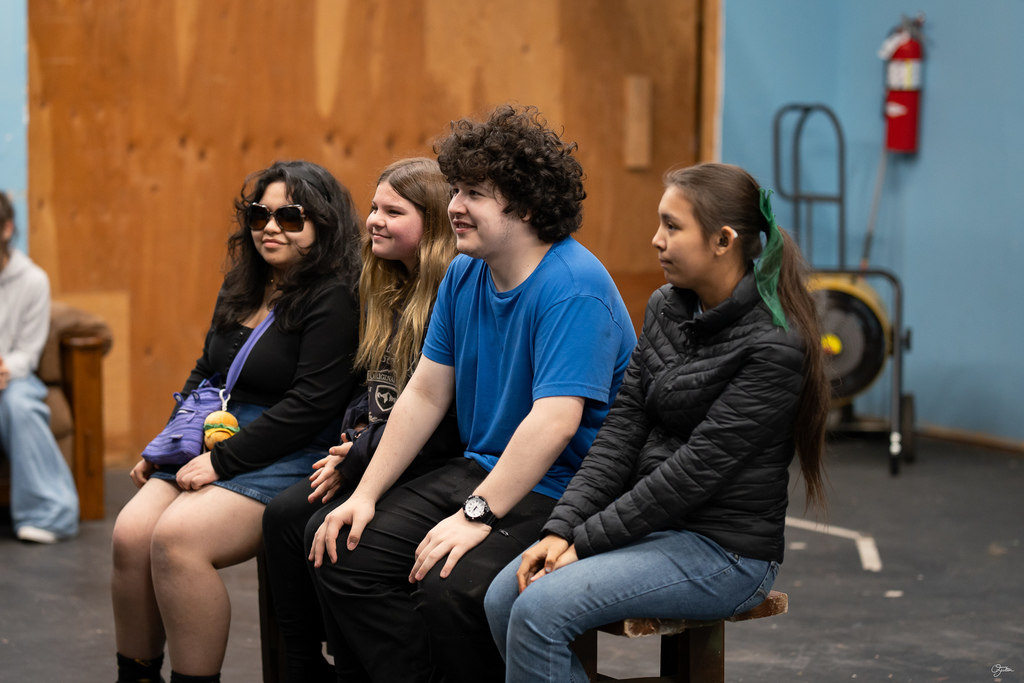 students acting in theater class
