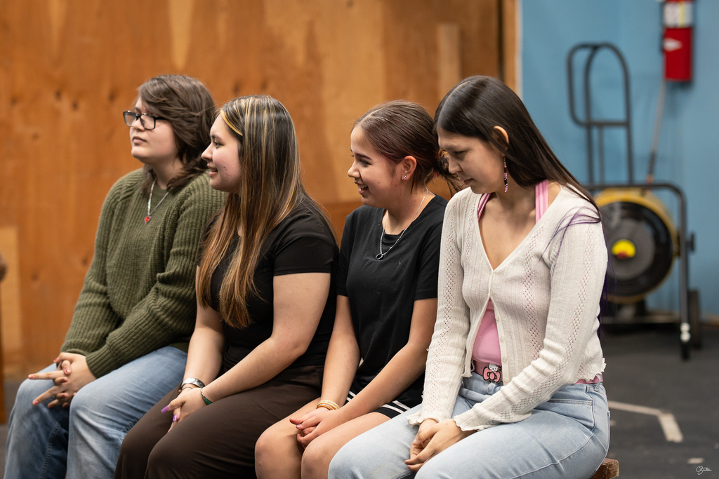 students acting in theater class