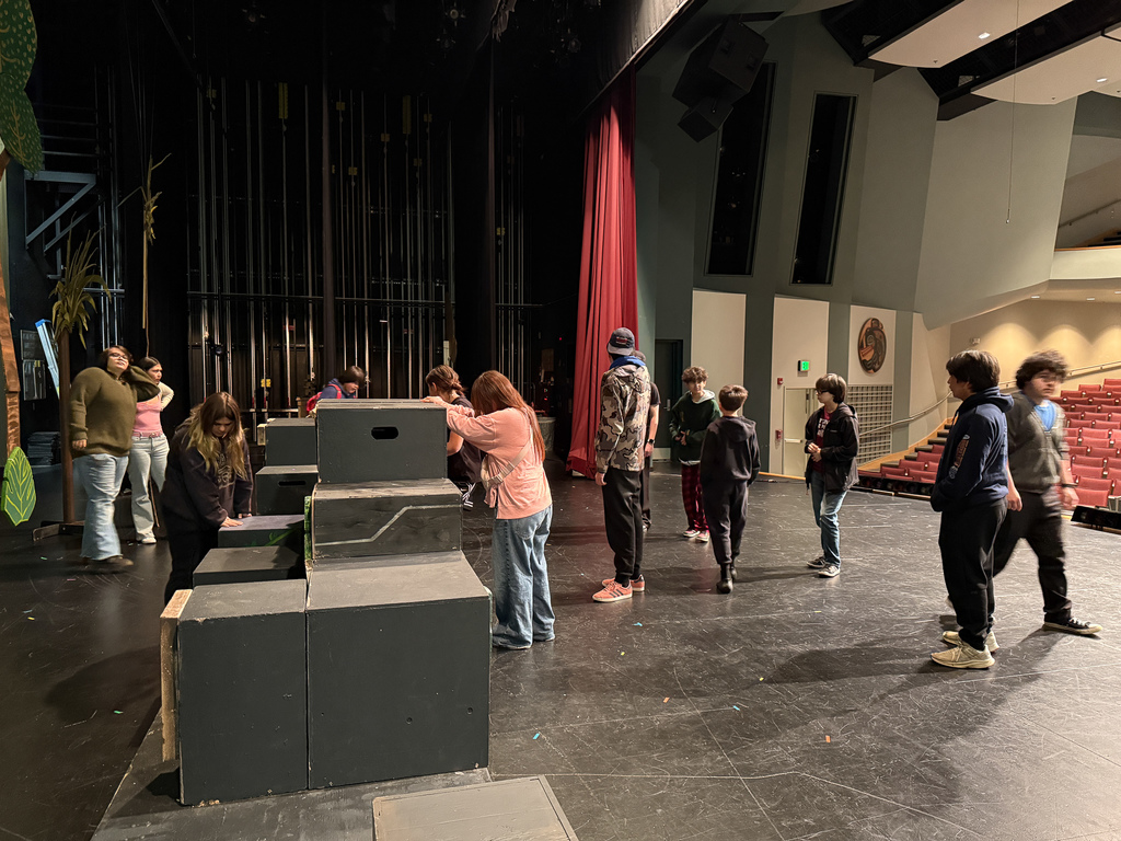 students acting in theater class