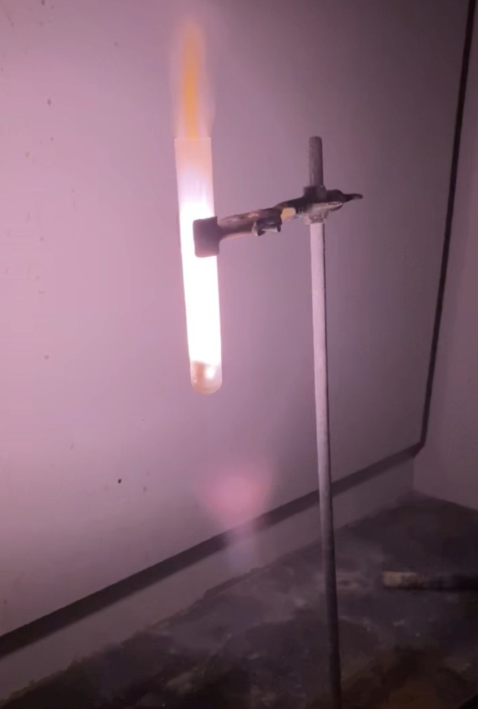 graduated cylinder with flame