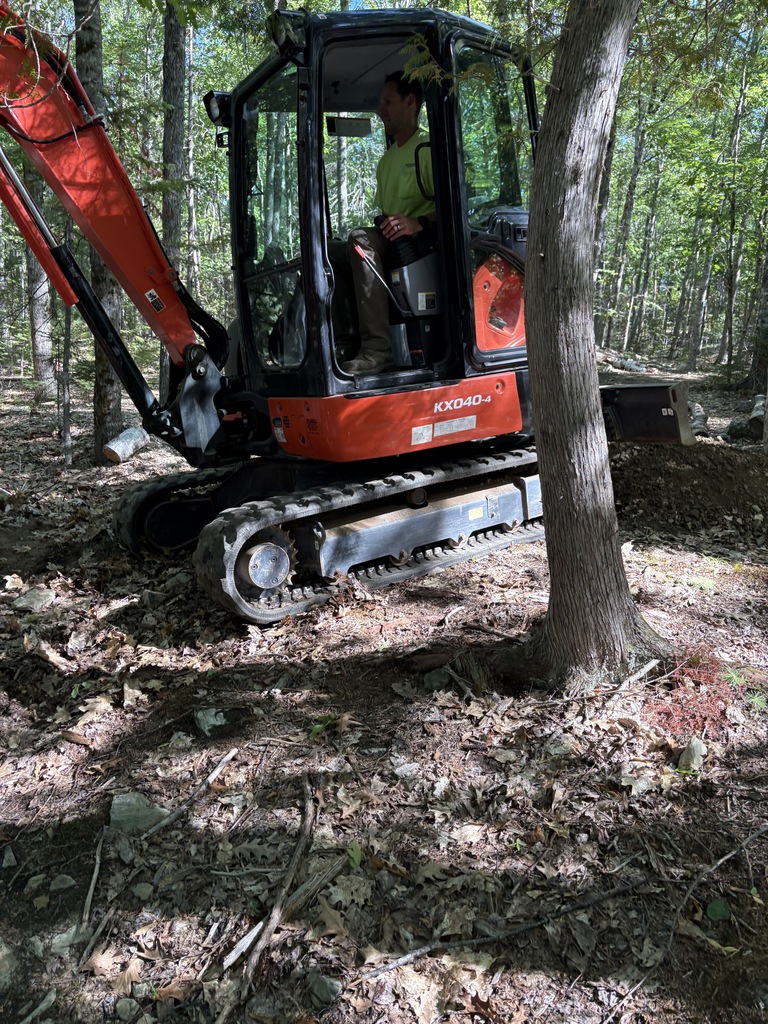 Excavator working on Dedham School trails.