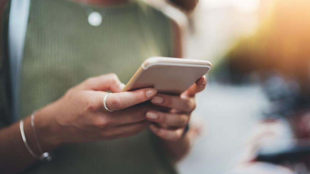 person texting on a phone