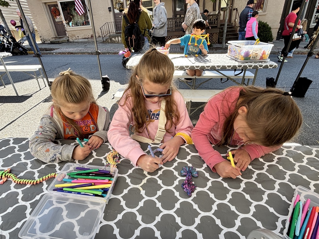 three children making art