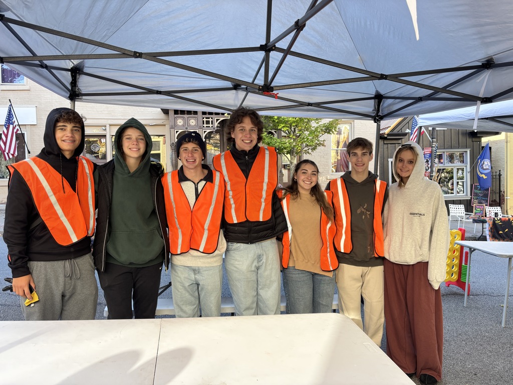 seven teenagers at a fall festival