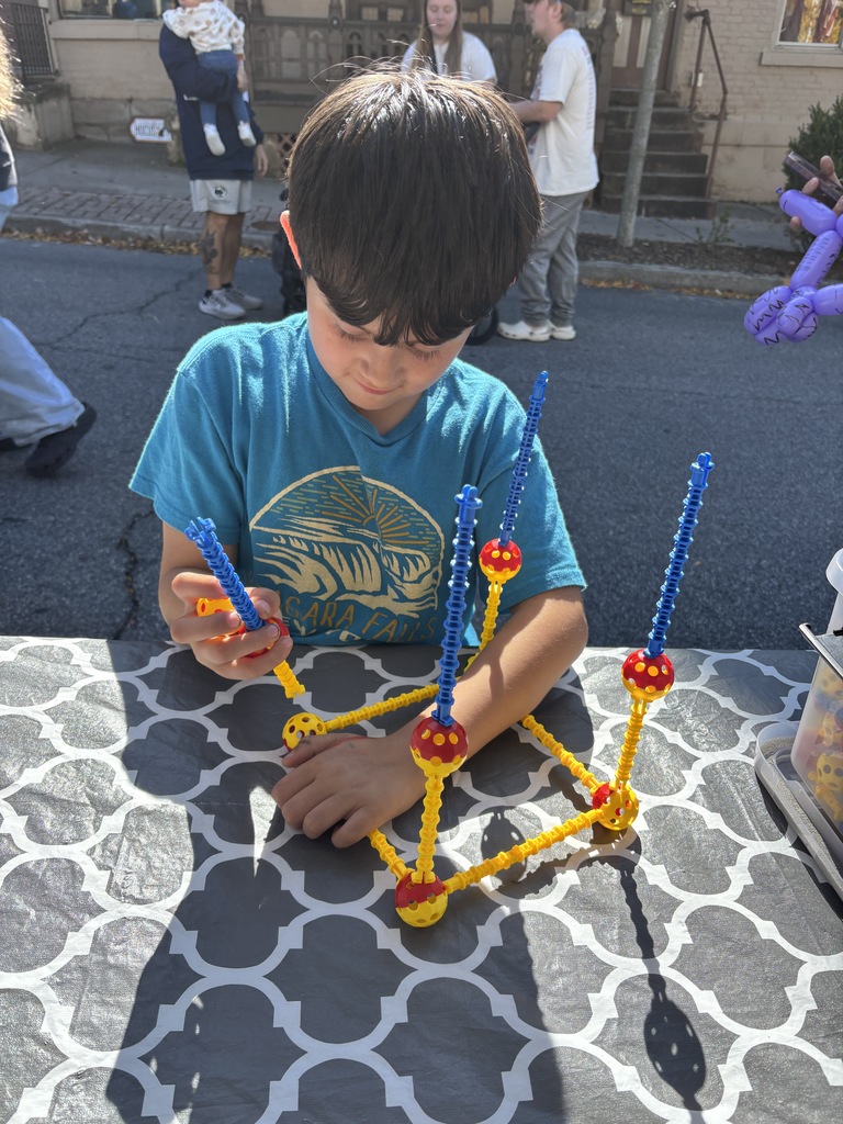 young child building a structure