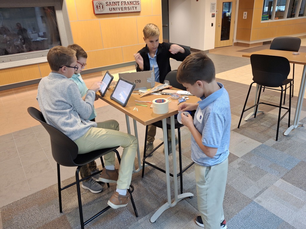 four students working at a table