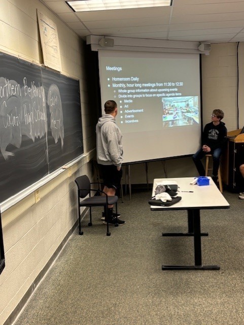 Two students presenting at a conference