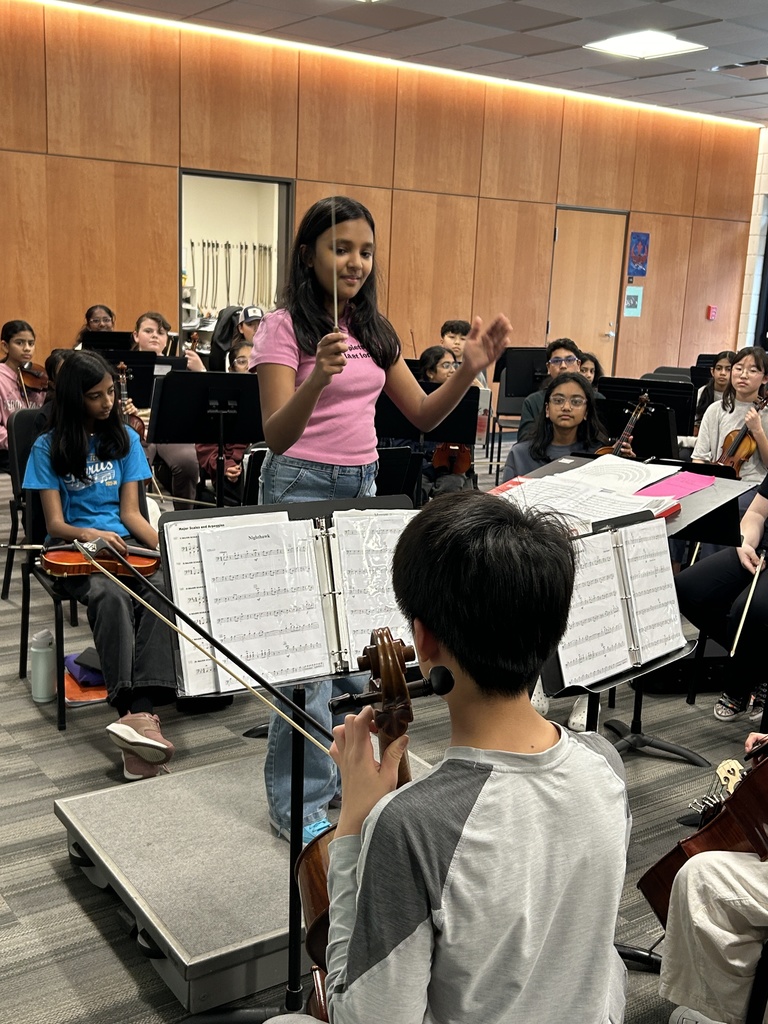 Student acting as the conductor in orchestra class.