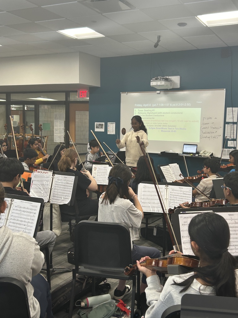 Student acting as the conductor in orchestra class.