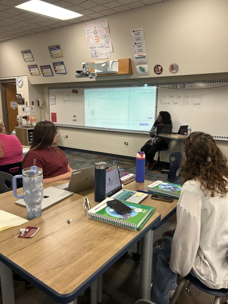 teachers sitting at a table.