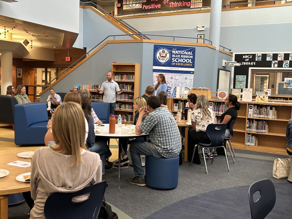 Staff speaking to new staff