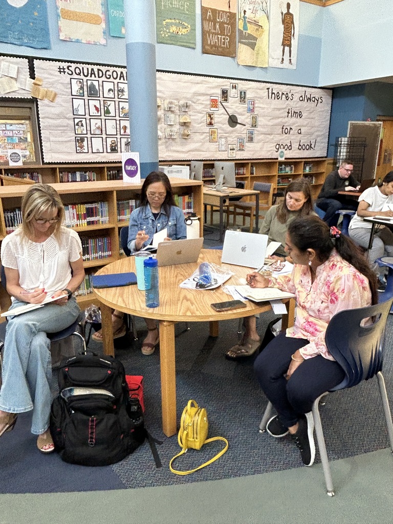 Staff writing in journals.