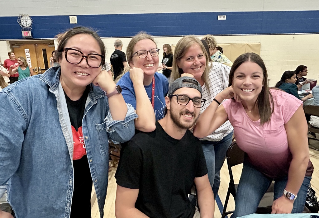 Teachers sitting together at a table.