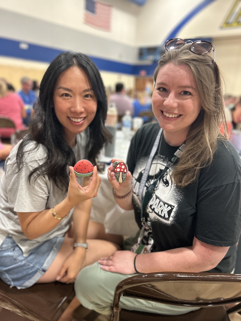 Teachers showing off their rocks.