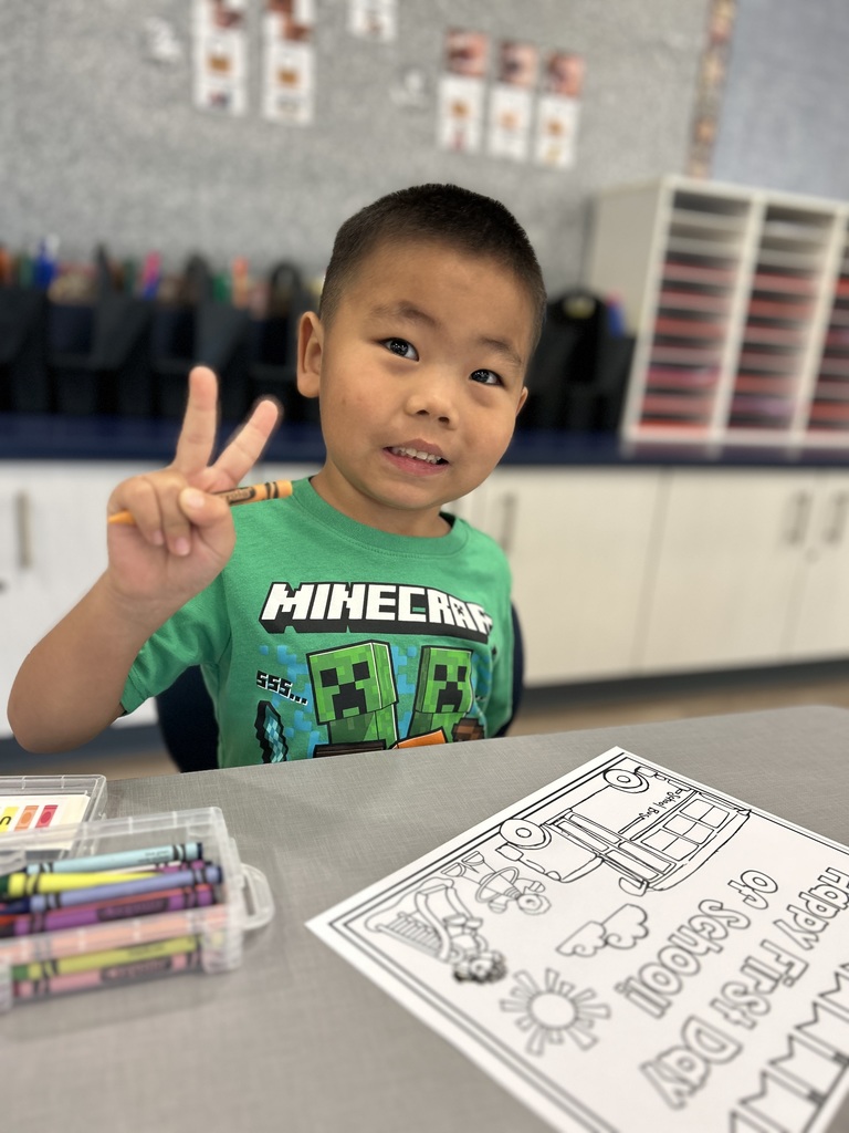 Student sitting at his desk.