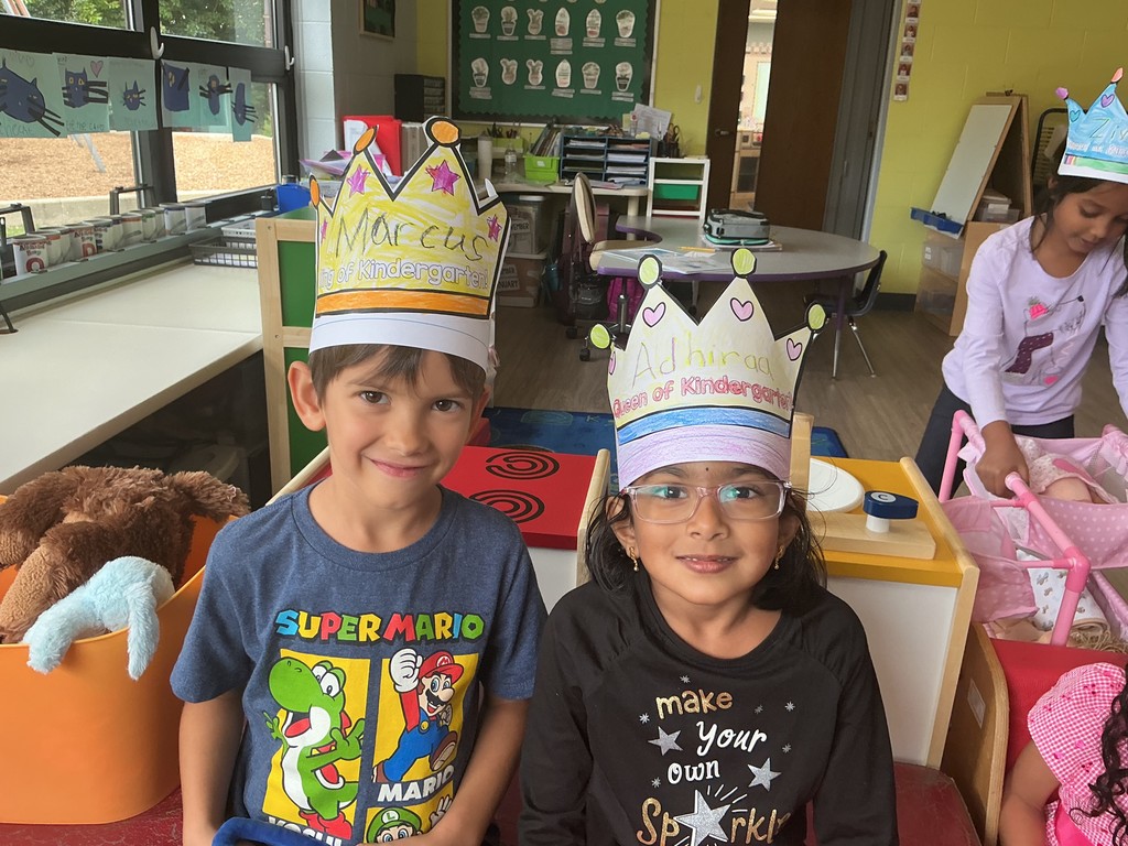 Kids wearing crowns.