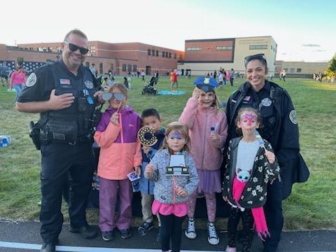 STudents standing with law enforcement 