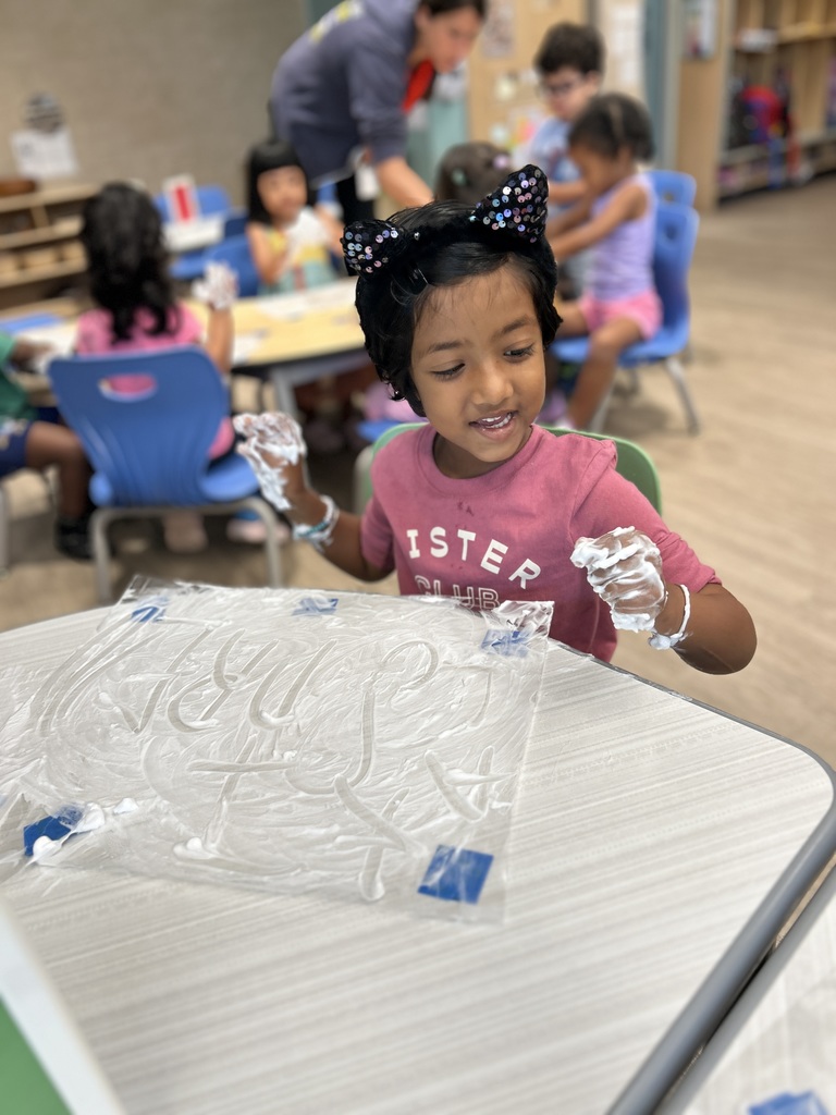 Student working with shaving cream.