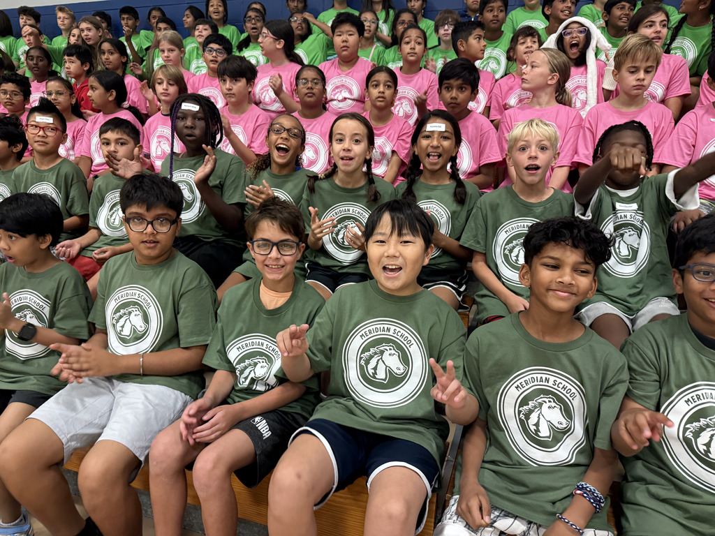 Students in the bleachers cheering.
