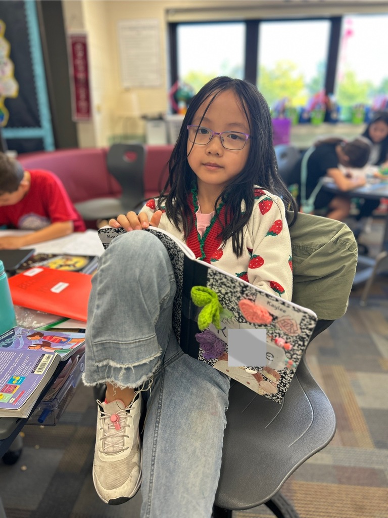 Student writing in her journal.