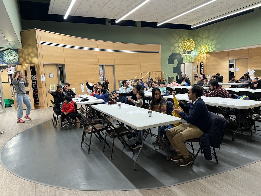 Parents sitting at tables.