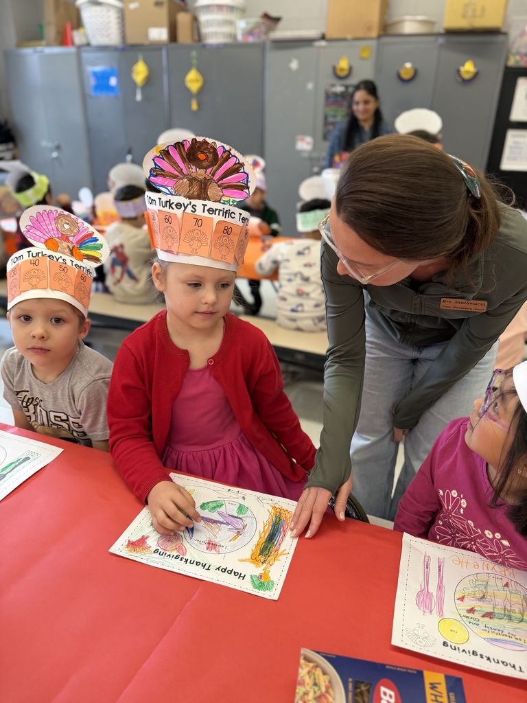Student sharing with a teacher what she is grateful for.